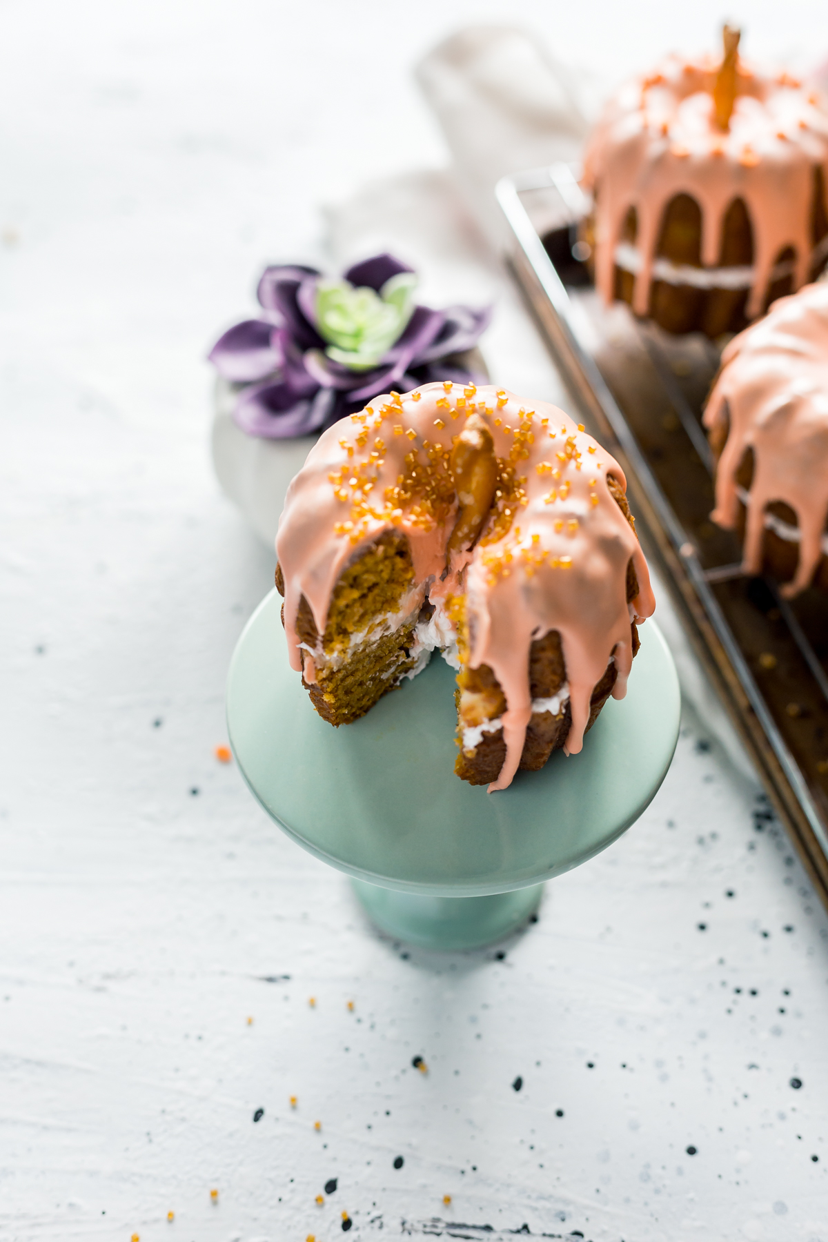 Mini Pumpkin Bundt Cakes with Cheesecake Filling