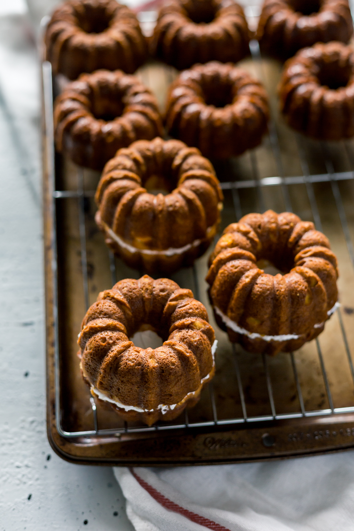 Mini Pumpkin Bundt Cakes with Cheesecake Filling