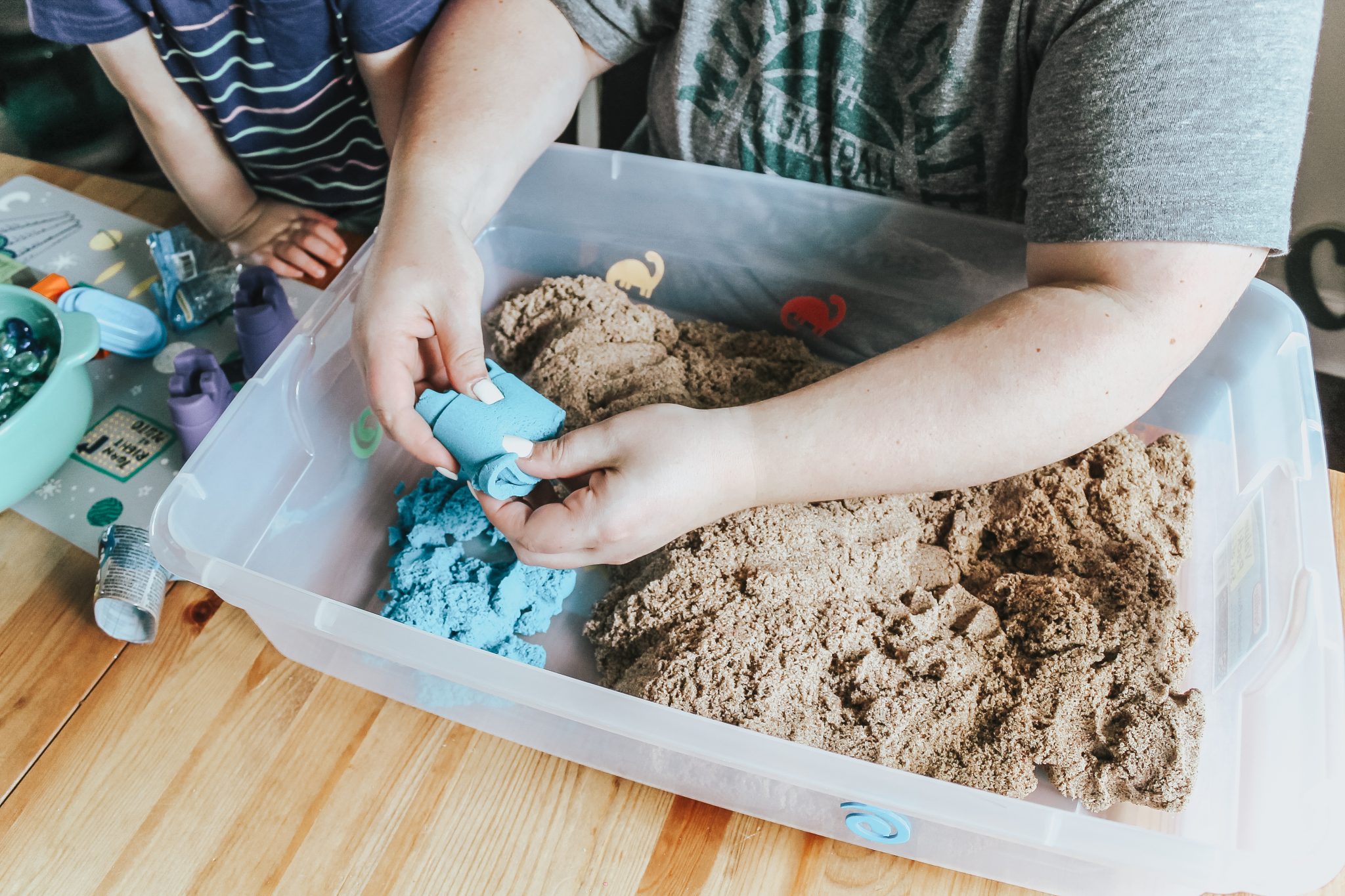 Dinosaur Island Sensory Bin with Kinetic Sand