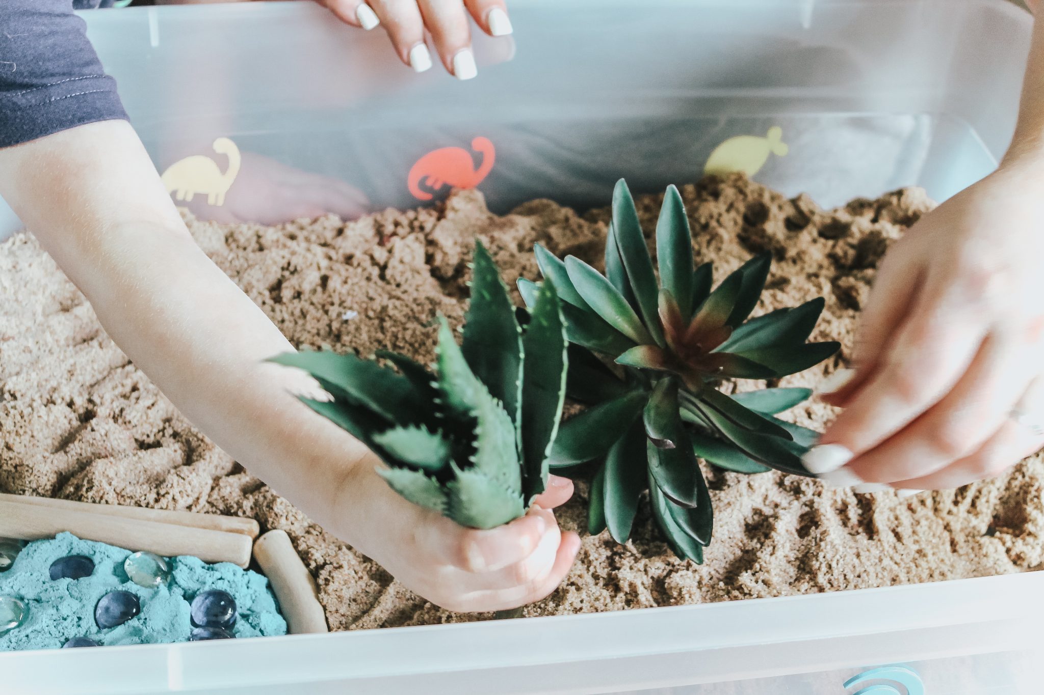 Dinosaur Island Sensory Bin with Kinetic Sand