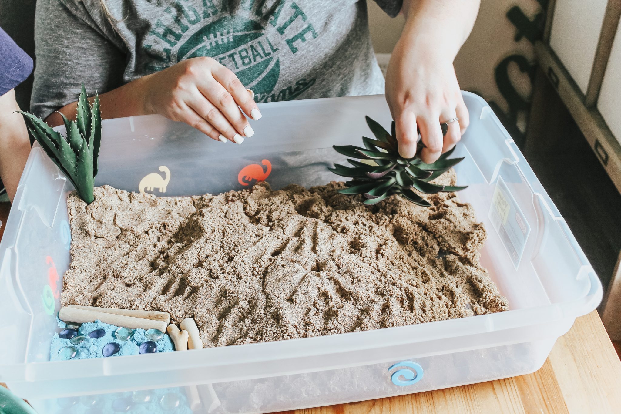 Dinosaur Island Sensory Bin with Kinetic Sand