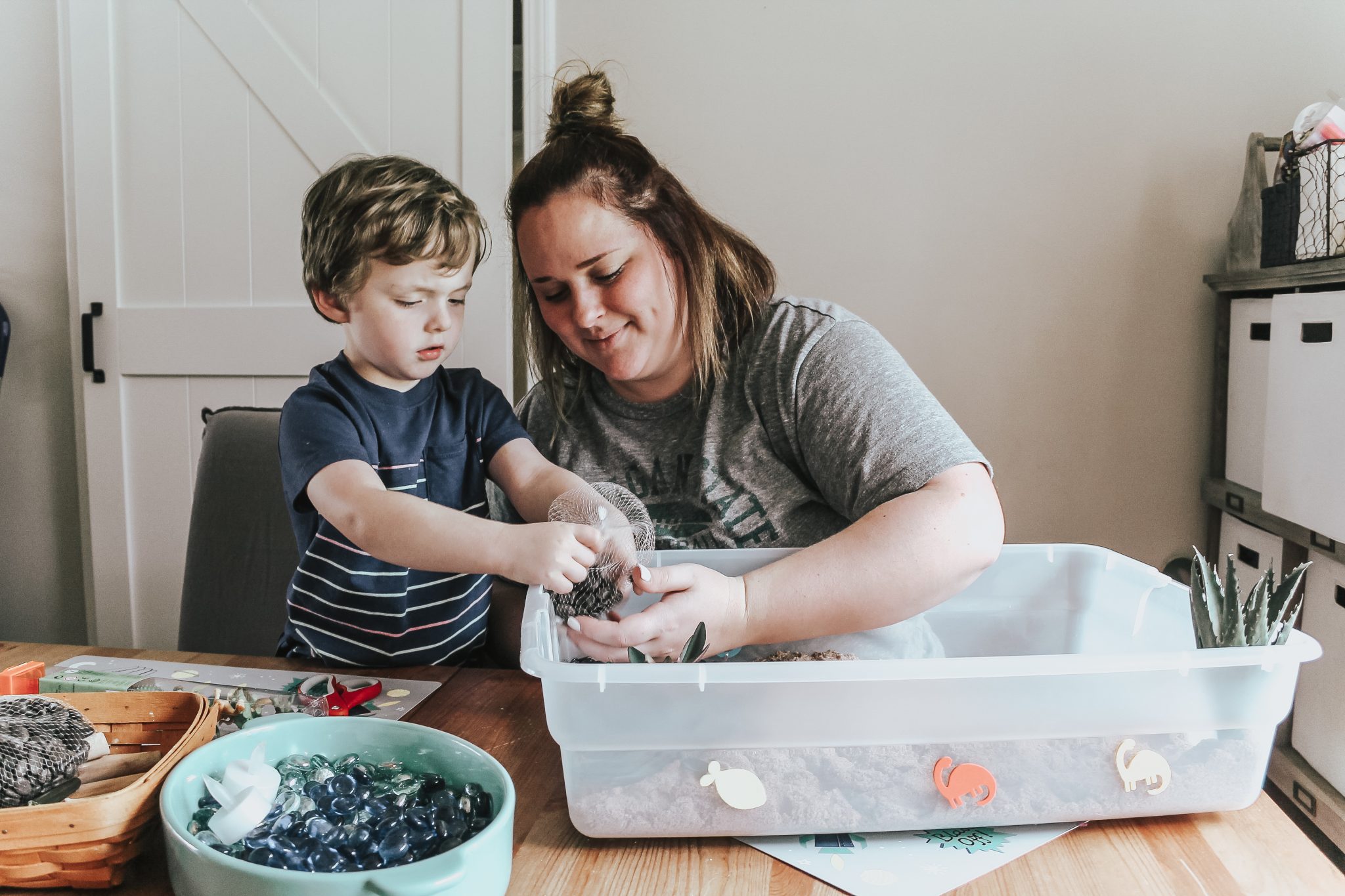 Dinosaur Island Sensory Bin with Kinetic Sand