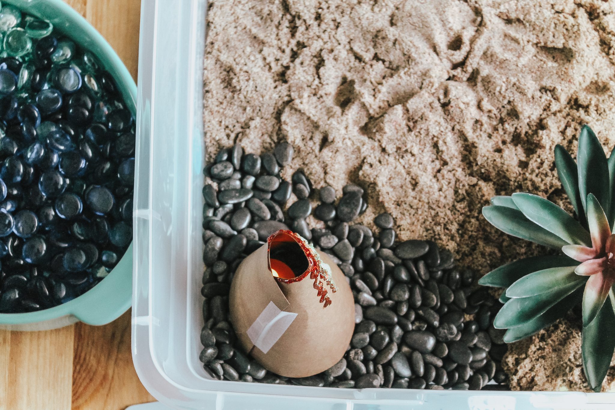 Dinosaur Island Sensory Bin with Kinetic Sand