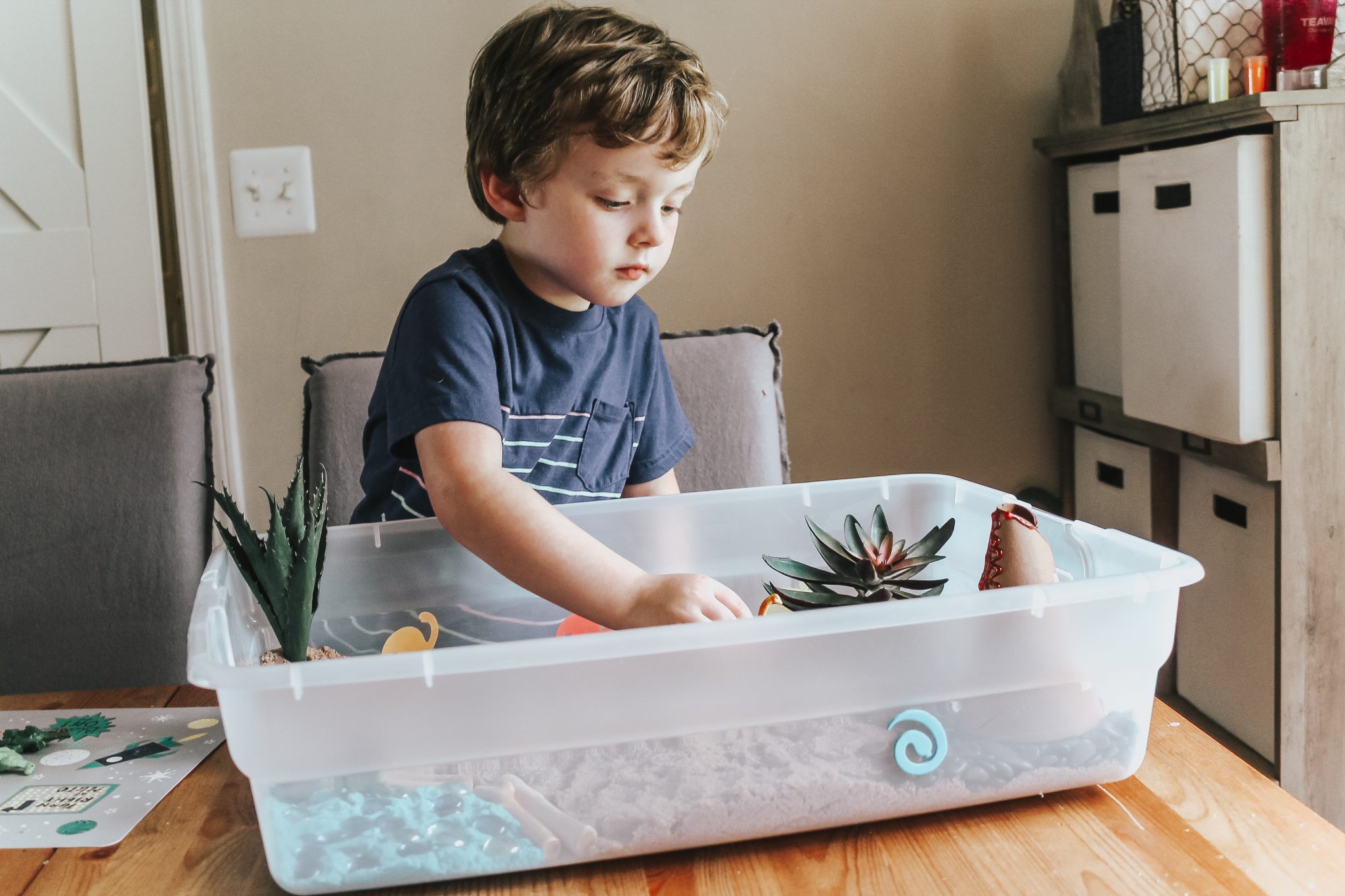 Dinosaur Island Sensory Bin with Kinetic Sand