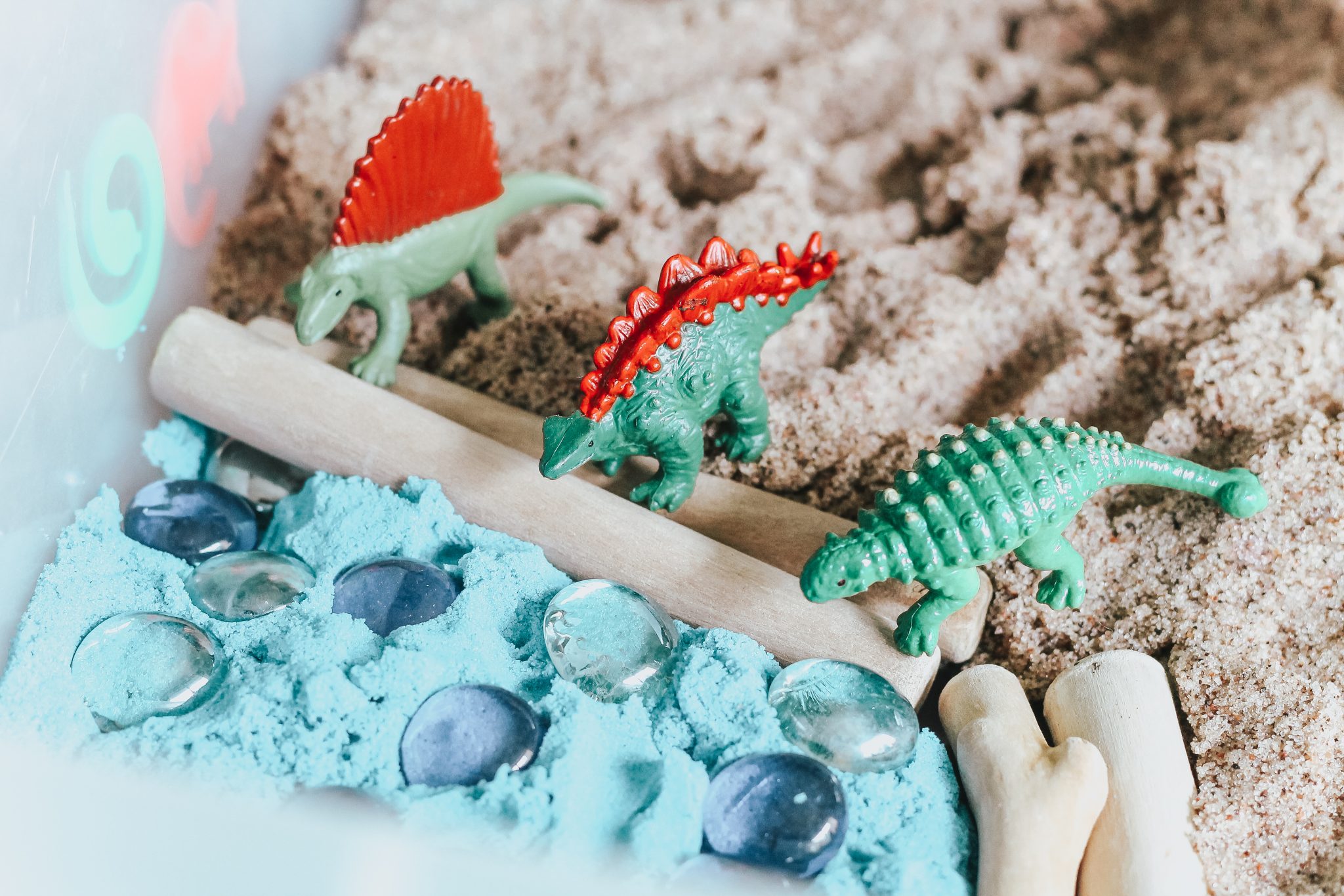 Dinosaur Island Sensory Bin with Kinetic Sand