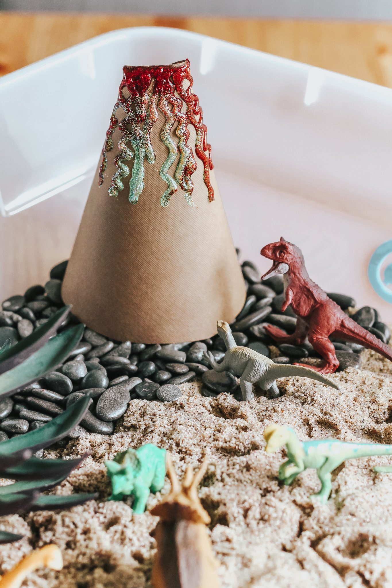 Dinosaur Island Sensory Bin with Kinetic Sand