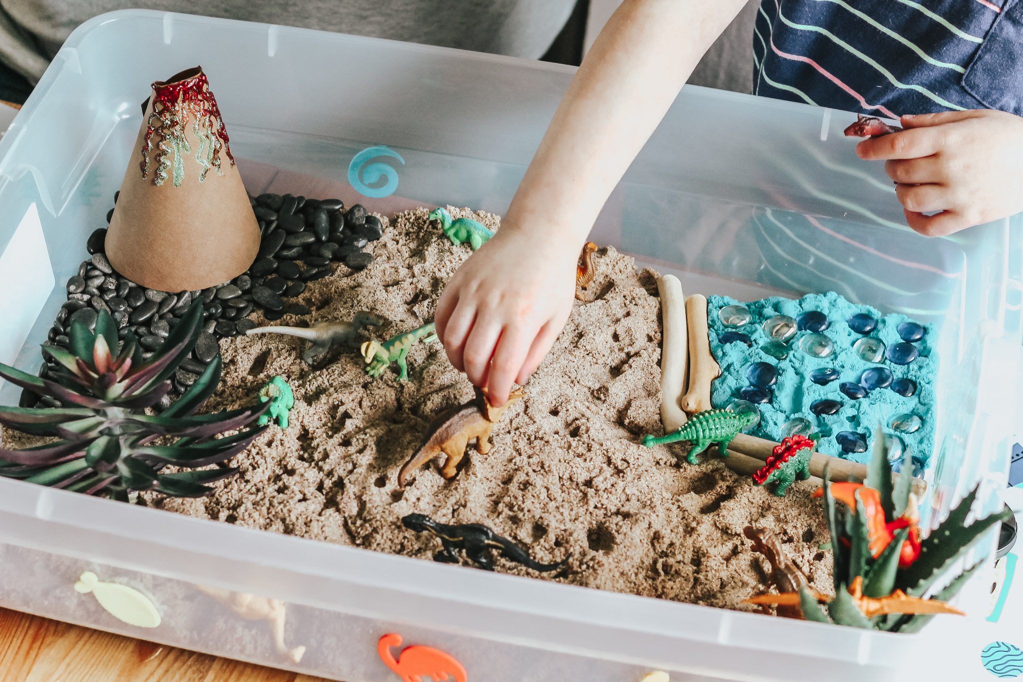 Dinosaur Island Sensory Bin with Kinetic Sand