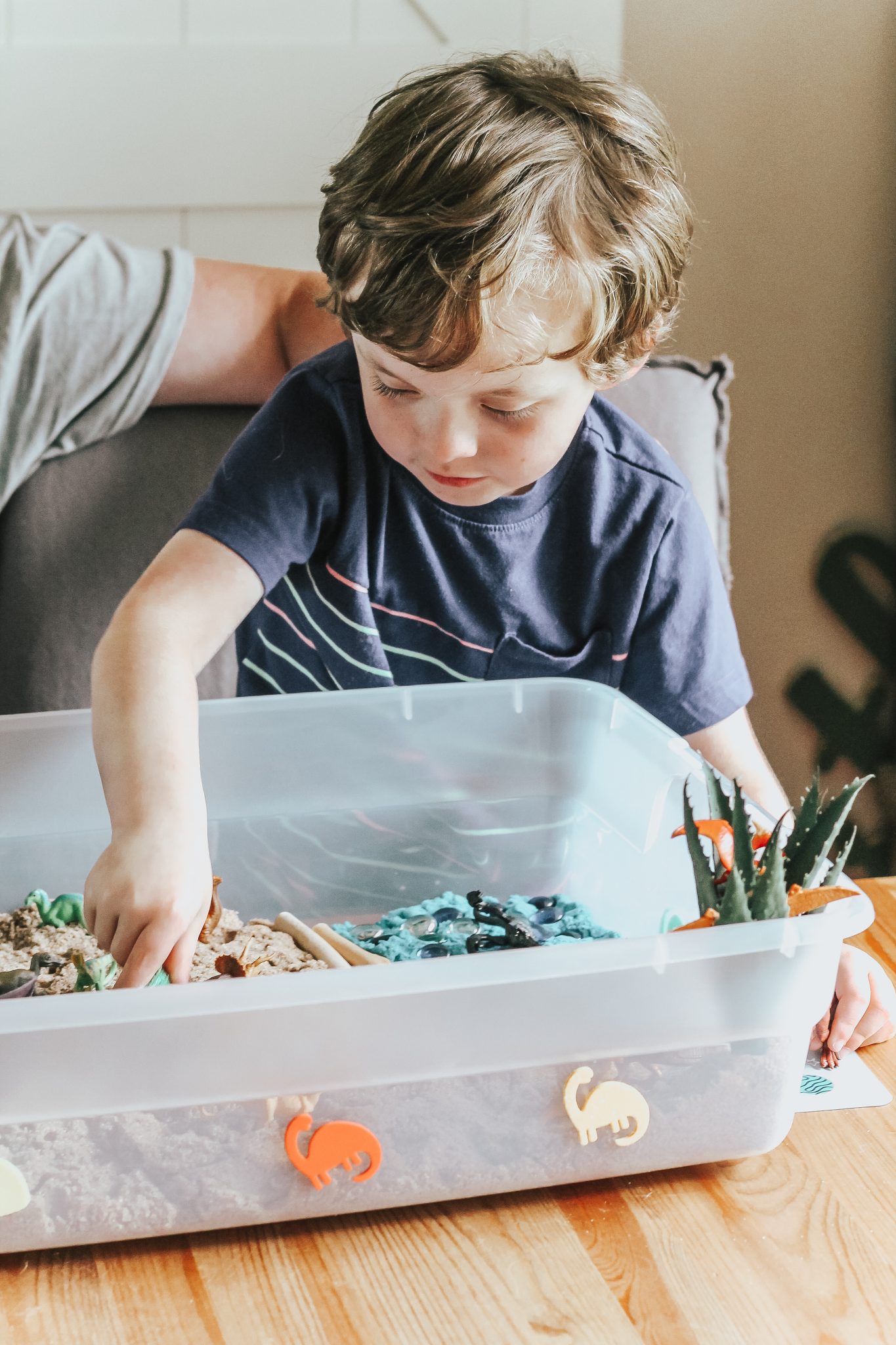 Dinosaur Island Sensory Bin with Kinetic Sand