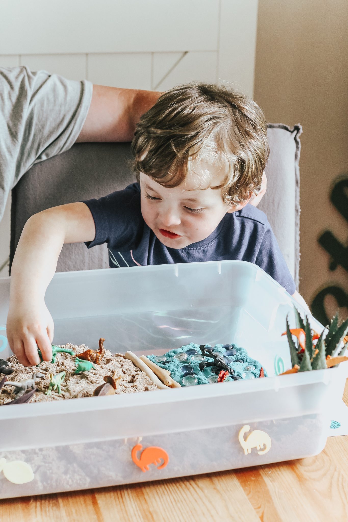 Dinosaur Island Sensory Bin with Kinetic Sand